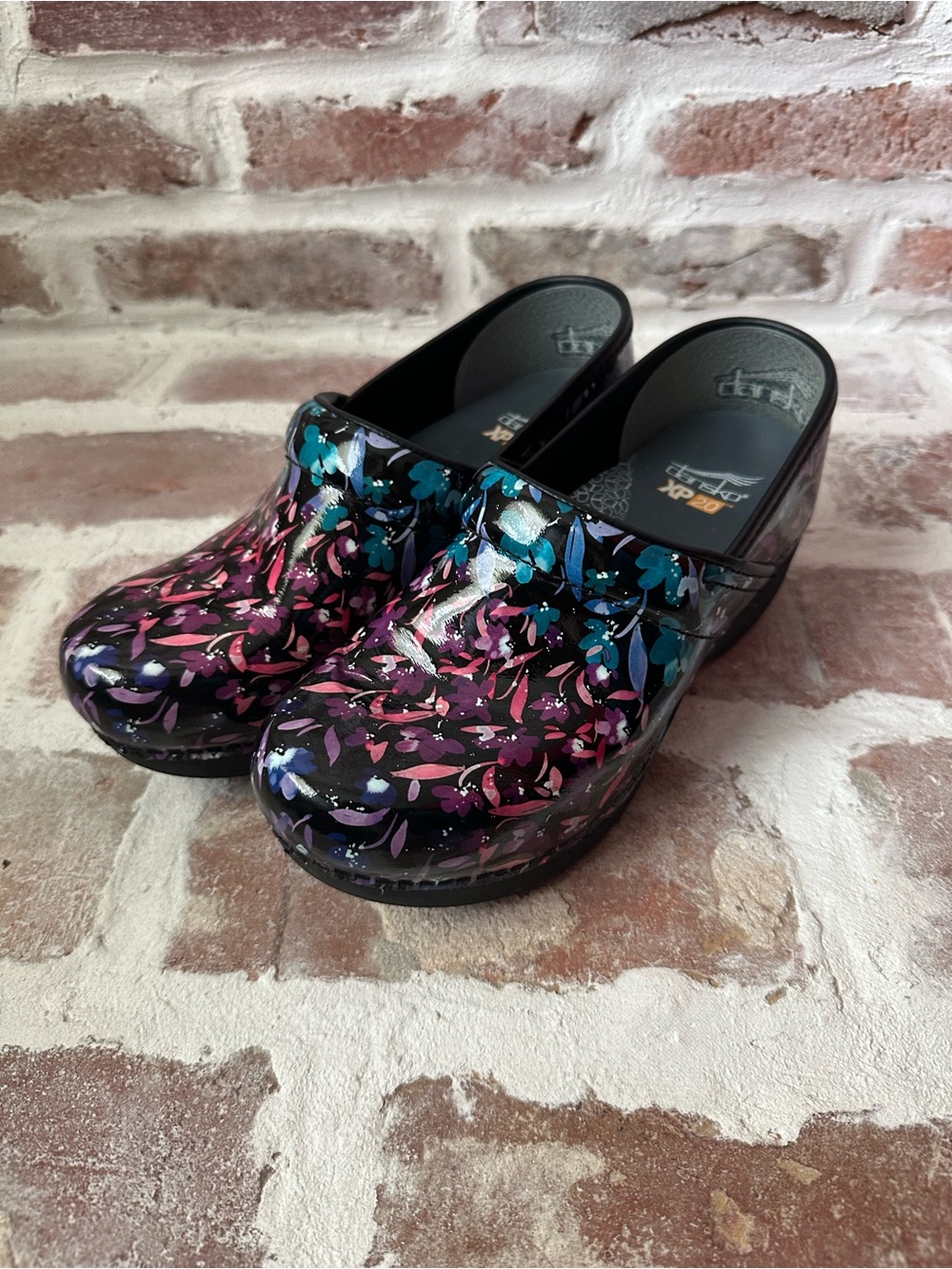 Dansko Floral Patent Leather Clogs in Black with Pink & Teal Accents